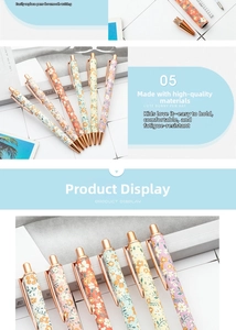 Close-up of floral pattern ballpoint pens with rose gold metal clips and clicker