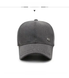 Detailed macro view of dark grey baseball cap with classic embroidery and metal plate