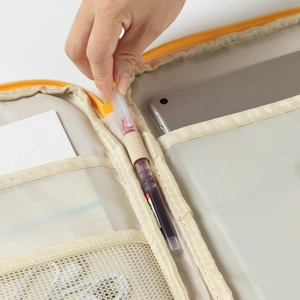 Detail view of the shockproof laptop sleeve interior with mesh pockets and pen slots