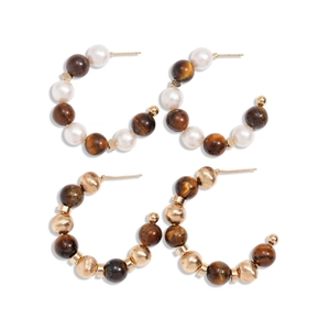 16K gold plated C-shaped hoop earrings with tiger eye beads and pearls on white base