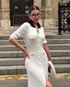 Detail of pearl buttons and contrast collar on a slim-fit knit midi dress
