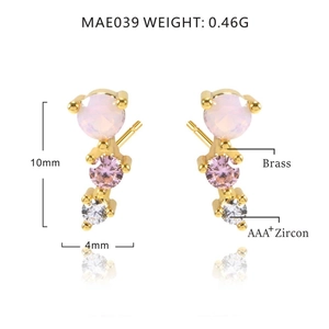 Detail view of gold-plated brass stud earrings with micro-set pink and white zircon stones