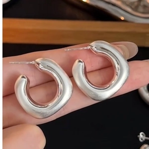 Minimalist geometric square-circle earrings with a thick silk satin finish in silver