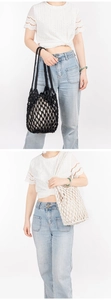 Detail of handmade cotton woven mesh tote bags in black and cream with fabric lining