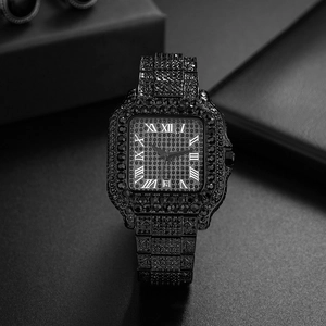 Macro view of iced-out black square watch with Roman numerals and date window detail