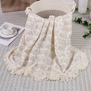 Muslin cotton baby blanket with vintage floral print and white fringe tassels for stroller