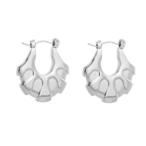Close-up of silver-tone fan-shaped drop earrings with textured metal surface detail
