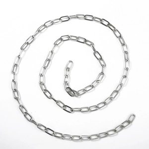 Detailed macro view of spiral layout silver snake chain necklace in stainless steel