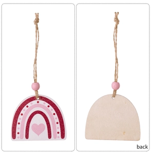 Front and back detail of pink wooden rainbow ornament with heart and dots decoration