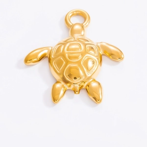 Close-up of a high-polished 18k gold-plated turtle pendant with metal hanging ring
