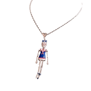 Vintage stainless steel skeleton sailor pendant necklace with enamel details on white background
