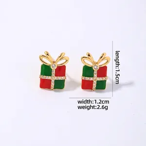 Close-up of red and green Christmas gift box stud earrings with bow details and sizing info