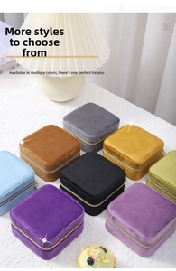 Close-up of velvet jewelry boxes in eight different colors with metallic zipper details
