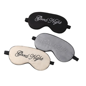 Three silk sleep masks in black, grey and champagne with Good Night embroidery