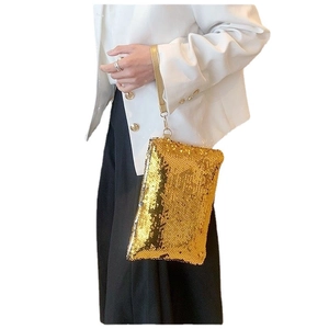 Golden sequin mini clutch bag with wrist strap for women elegant evening party look