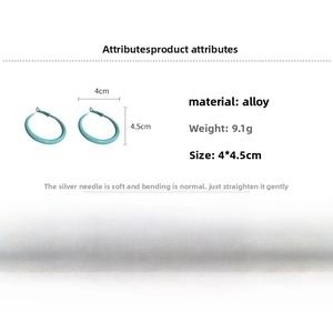 Detailed view of matte turquoise hoop earrings with 4cm diameter and silver needles