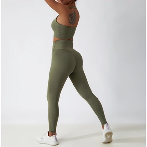 Side view of olive green high-waisted yoga leggings and sports bra set for women
