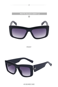 Detail view of matte black cat eye sunglasses with purple gradient lenses and wide temples