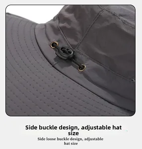 Detail showing the adjustable elastic drawstring and metal eyelet on a grey outdoor hat