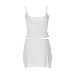 Detailed view of white two-piece set featuring camisole and mesh hem skirt detail