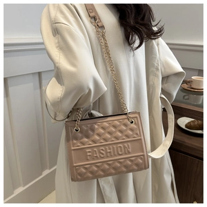 Detail of khaki embossed crossbody bag with chain strap and FASHION lettering