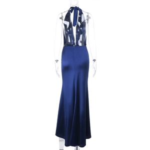 Detail view of the back of a deep blue satin evening gown with halter neck and backless cut