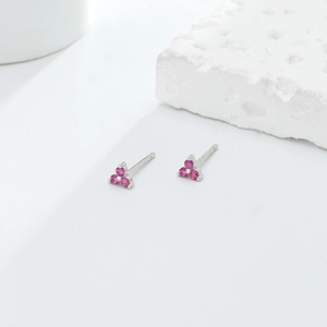 Detail of S925 silver triangle earrings featuring three pink zircons in a floral setting