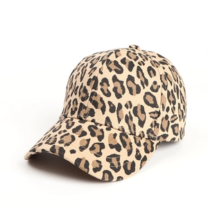 Detailed close-up of a leopard print baseball cap with curved brim on white background