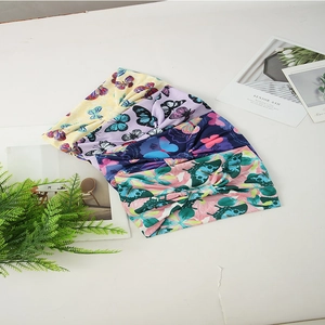 Set of four butterfly print elastic yoga headbands in vibrant assorted floral colors