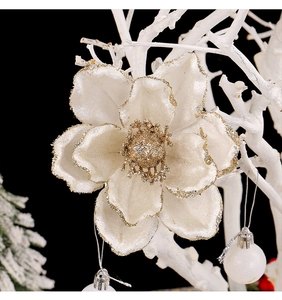 Detail of cream white poinsettia flower with golden glitter edges for Christmas decor