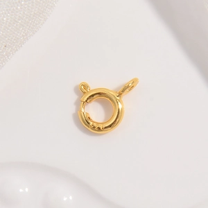 Macro shot of 5mm-6mm gold-plated S925 sterling silver spring ring clasp for jewelry DIY