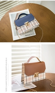Detail showing checkered patterns, gold metal twist lock, and handle of the fashion bag
