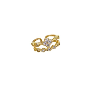 Adjustable golden four-leaf clover ring with sparkling pave crystals on a white background