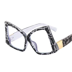Oversized butterfly frame eyeglasses with grey leopard animal print and gold metal accents
