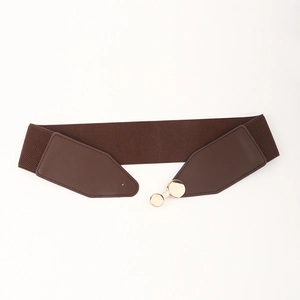 Detail showing deep brown elastic waist belt with gold circular metal buckle for coats