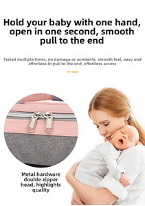 Detail of smooth two-way metal zippers on the pink and grey contrast baby diaper backpack