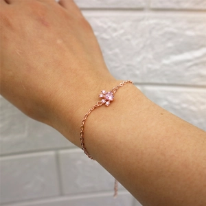 Rose gold chain bracelet featuring a pink heart stone and crystals in a cute paw shape