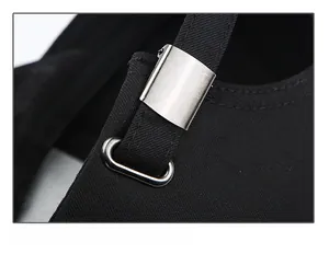 Detail of adjustable metal buckle and strap on a black cotton baseball cap for men