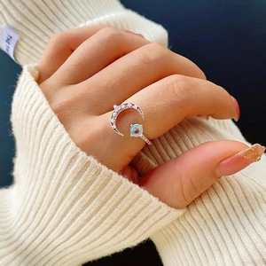Elegant adjustable crescent moon ring with blue stone and pavé diamonds for women