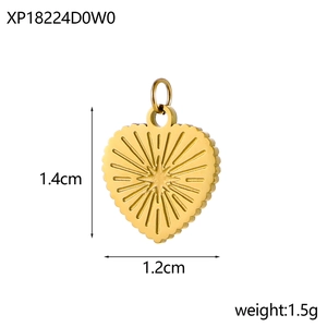 Macro view of a 1.4cm gold heart pendant showing dimensions and textured starburst detail