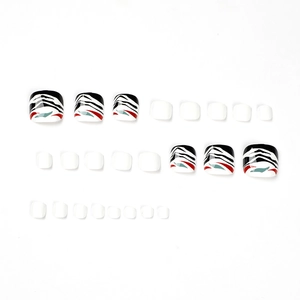 Press-on toenails featuring black, white, and red abstract stripes with minimalist white design