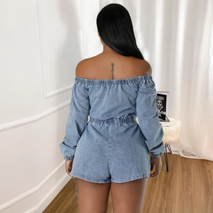 Back view of a light blue denim romper featuring elastic off-shoulder neckline and slim waist