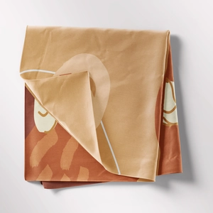 Detail of bohemian tapestry featuring abstract geometric patterns in warm earth tones