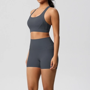 Detail of high-waisted yoga shorts with side pockets and a matching sports bra