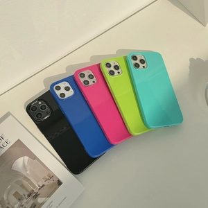 Detailed view of glossy silicone phone cases in multiple colors with camera protection