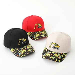 Detail of kids baseball caps featuring excavator embroidery and printed construction vehicles