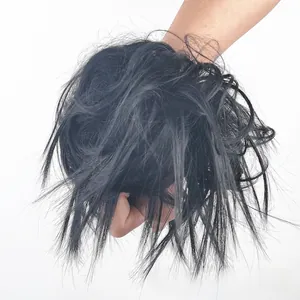Detailed close-up of messy black synthetic fiber hair bun extension on white background