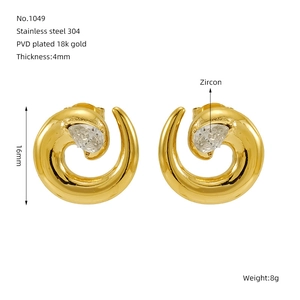 Detail view of gold snake-shaped earrings with zircon and size specifications