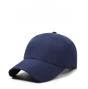 Detail view of a navy blue quick-dry baseball cap with curved brim and reinforced stitching