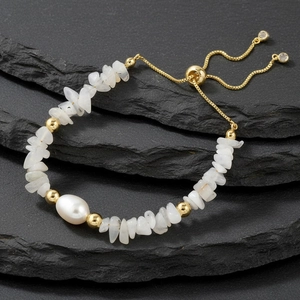 Detail of adjustable natural stone bracelet with freshwater pearl and gold beads